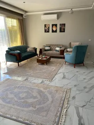 a living room with two couches and a table at Sky Star Villa 30 in Hurghada