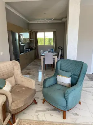 a living room with a couch and a chair at Sky Star Villa 30 in Hurghada