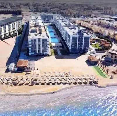 an aerial view of a resort on the beach at fanadir resort in Hurghada