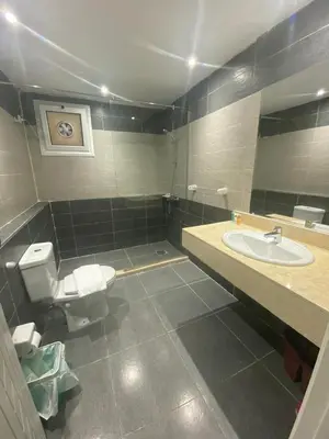 a bathroom with a toilet and a sink at Fanadir Chalet 3BR in Hurghada