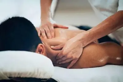 a man getting a massage from a therapist at NG Trips in Hurghada