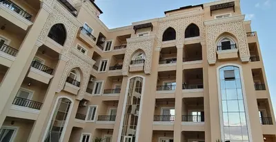 a facade of a building with large windows at Moon Hills Palace in Hurghada