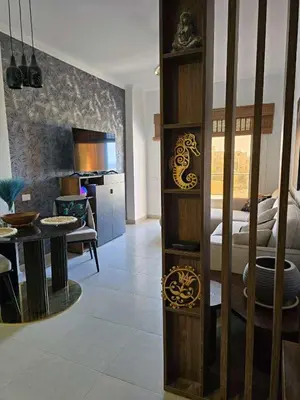 a living room with a room with a bed at Hurghada ,Mo&Kate Florenza Khamsin in Hurghada