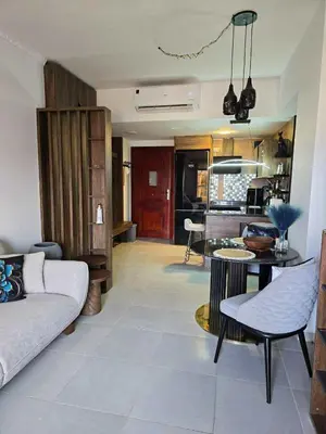 a living room with a couch and a table at Hurghada ,Mo&Kate Florenza Khamsin in Hurghada