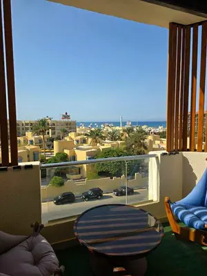 a room with a balcony with a view of a city at Hurghada ,Mo&Kate Florenza Khamsin in Hurghada