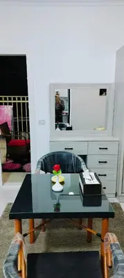 a living room with a coffee table and a desk at Hurghada neighborhoods in Hurghada