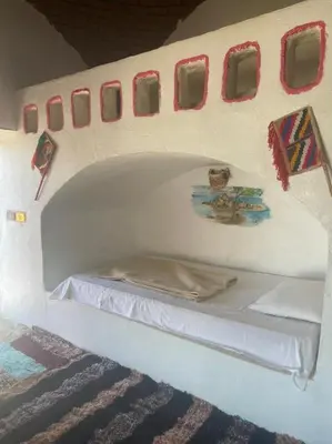 a small bed in the back of a plane at فندق اجيليكا in Aswân Reservoir Colony