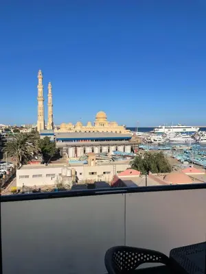 a view of a city from a balcony at VERO Residence in Banī Ghālib