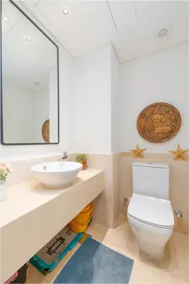 a bathroom with a white toilet and a sink at Dreamy gateway in Ancient Sands in Hurghada