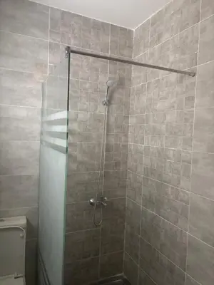 a shower with a glass door in a bathroom at Apt at Panorama view in Hurghada