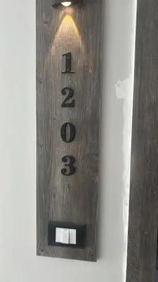 a wooden clock is hanging on a wall at Apt at Panorama view in Hurghada