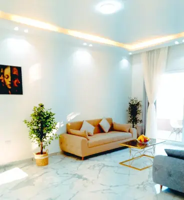 a living room with a couch and a table at VIP villa heated pool & Spa & fully entertained in Hurghada