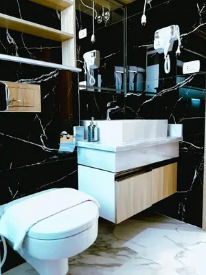 a bathroom with a white sink and a toilet at VIP villa heated pool & Spa & fully entertained in Hurghada