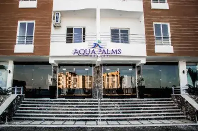 a store front of a building with a door at Aqua palms in Hurghada