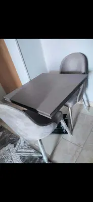 a table and a chair in a room at Al helal in Hurghada