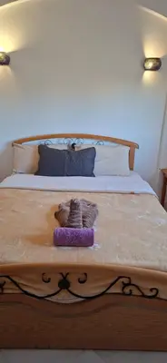 a bed with two towels on top of it at El Gouna Upper nubia in Hurghada