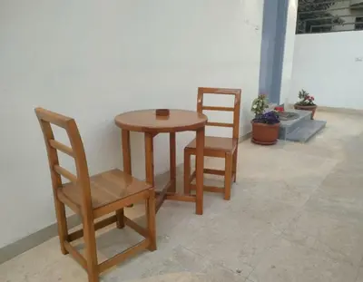 two chairs and a table and a table and chairs at Desert Daisy in Luxor