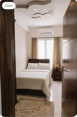 a bedroom with a bed and a window at Luxor Temple & Local Life at Your Doorstep Al FahadAprtments in Luxor