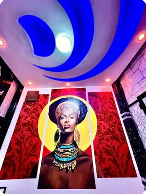 a painting of a woman on the ceiling of a room at Luxor Temple & Local Life at Your Doorstep Al FahadAprtments in Luxor
