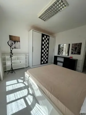 a bedroom with a bed and a camera in it at Pause by The Sea Hurghada, Stay, Relax, Repeat in Hurghada
