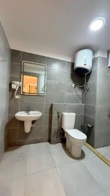 a bathroom with a toilet and a sink at Kuba luxury loft in Hurghada