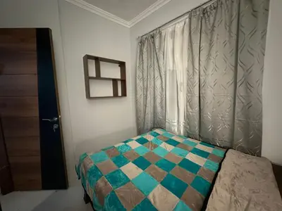 a small bedroom with a bed and a window at Desert Pearl Lux in Hurghada