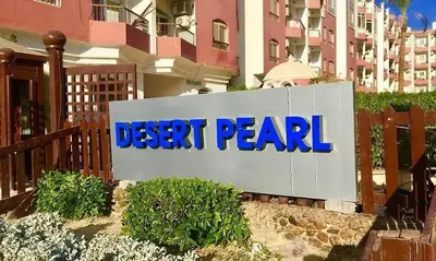 a dear pearl sign in front of a building at Desert Pearl Lux in Hurghada