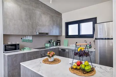 a kitchen with two baskets of fruit on a counter at Wonderful Holiday Home in Stunning Soma Bay in Hurghada