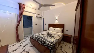 a hotel room with a bed in a room at Alia House in Luxor
