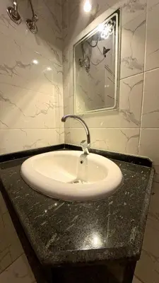 a bathroom with a sink and a mirror at Alia House in Luxor