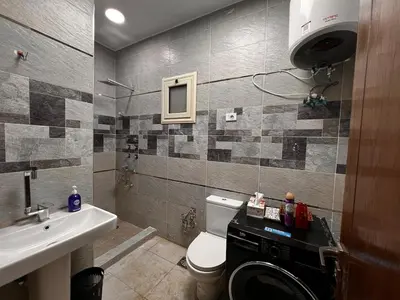 a bathroom with a toilet and a sink at Modern Riverside Apartment 3BR in Aswan Downtown in Aswan