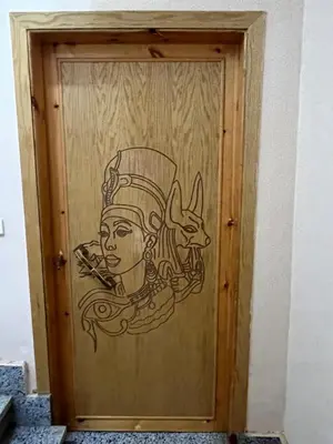 a door with a drawing of a chef on it at Lokanda lodge&Apartments in Luxor