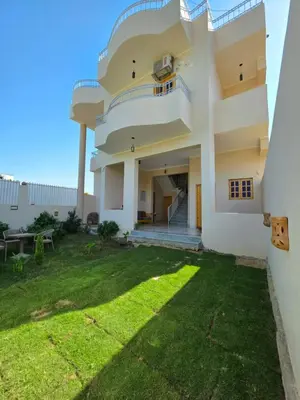 a view of a house with a yard at Lokanda lodge&Apartments in Luxor