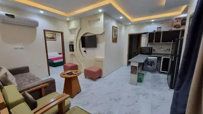 a living room with a couch and a table at One Bedroom Chalet Mirage Bay in Hurghada