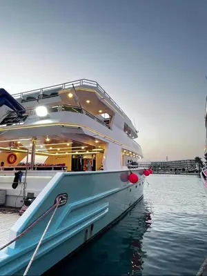 a large boat docked at a dock in the water at The yacht in Hurghada