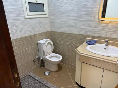a bathroom with a toilet and a sink at Turtles Beach Resort in Hurghada in Hurghada