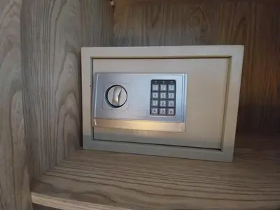 a microwave in a room with a wooden wall at Scandic Resort Sea View Room in Hurghada