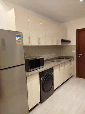 a kitchen with a stainless steel refrigerator and a dishwasher at Princese Resort Beach 1ST Avenue SouthSide in Hurghada