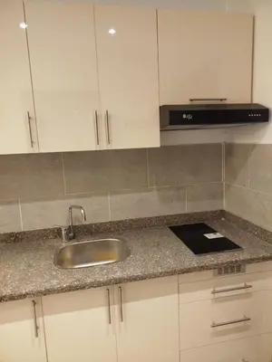 a kitchen counter with a sink and a microwave at Princese Resort Beach 1ST Avenue SouthSide in Hurghada