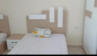 a room with a bed with a pillow on it at Mirage aquapark resort 776c in Hurghada