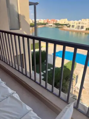 a balcony with a view of a body of water at Chic condo at Tawila 1BR El Gouna in Hurghada