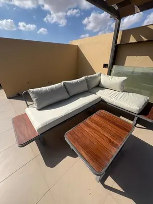 a couch and a table on a roof at Chic condo at Tawila 1BR El Gouna in Hurghada