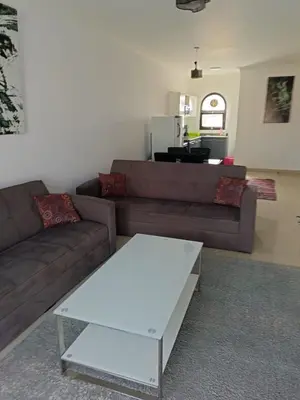 a living room with a couch and a coffee table at كمباوند ذا فيو The View Compound in Hurghada