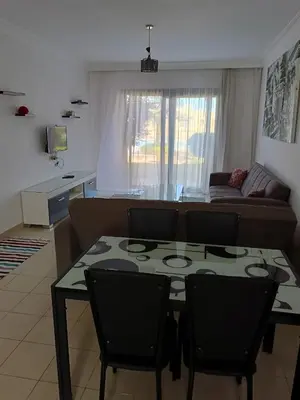 a living room with a table and a couch at كمباوند ذا فيو The View Compound in Hurghada