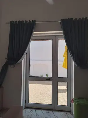 a window with black curtains in a room at Villa Mena Luxor in Luxor