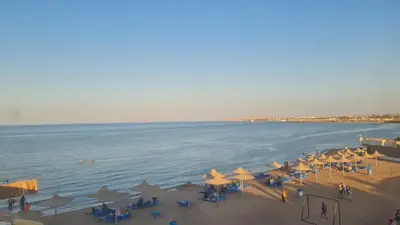 an aerial view of a beach with umbrellas and the ocean at Cecelia Resort Hurghada in Hurghada