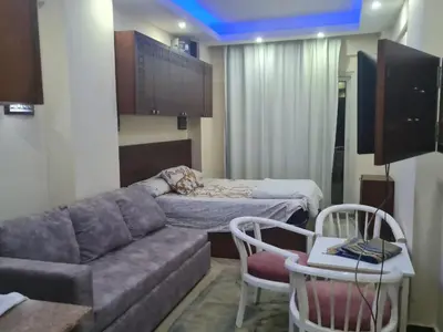 a living room with a couch and a bed at Cecelia Resort Hurghada in Hurghada