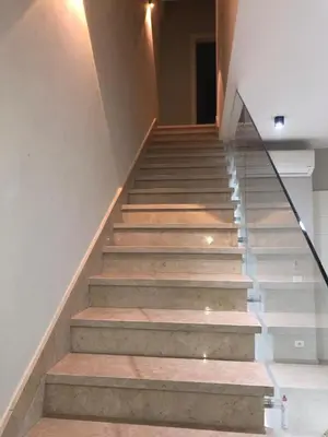 a set of stairs in a house with glass railing at Tawila villa 14 in Hurghada
