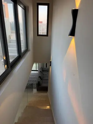 a hallway with two windows and a stair case at Tawila villa 14 in Hurghada