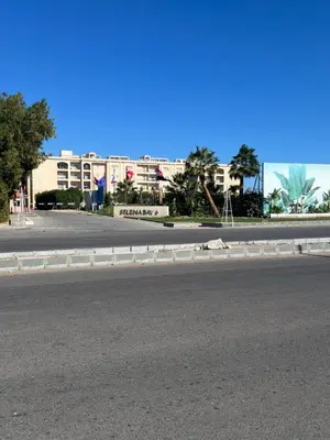 an empty street with a building in the background at Selena bay hurghada in Hurghada